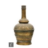 A Safavid style hammered brass vase, of bottle form, the shoulder decorated with a series of