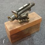 An early 20th Century brass laquered theodolite, the base fitted with a silvered compass by