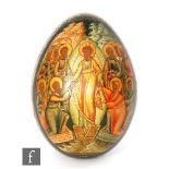 An Imperial Russian papier mache Easter egg painted with the risen Christ amongst the Apostles to