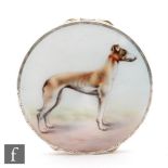 A hallmarked silver circular box with enamelled study of a standing dog to the hinged cover,