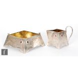 A Russian silver cream jug and sugar basin of square form each detailed with two red stones and part