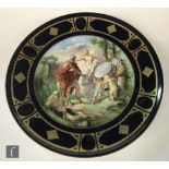 A late 19th to early 20th Century Vienna charger decorated with a transfer applied scene of