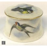 A small Royal Worcester trinket or pill box decorated to the cover with two transfer decorated and