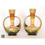 A pair of late 19th Century Royal Bonn vases of globe and shaft form each decorated with hand