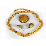 An attractive Art Deco amber stone Brooch, with attractive mount,