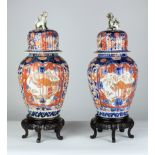 A pair of attractive 19th Century Imari bulbous Jars and Covers,