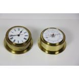 A small modern circular brass Wall Clock, and a similar matching Barometer.