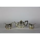 A 3 piece Chester silver Teaset, with teapot (wooden handle) sugar and cream, all of oval shape,