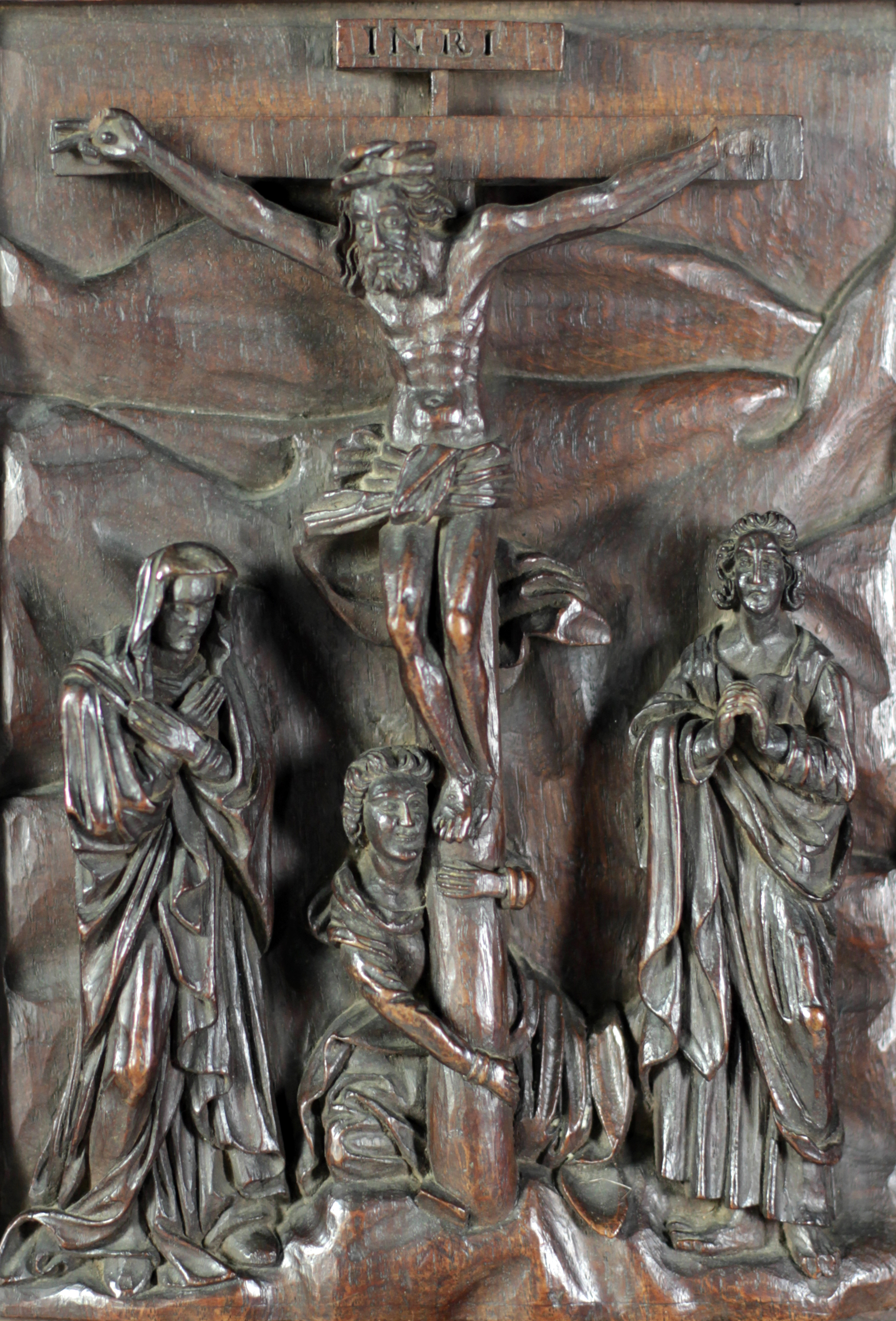 An important 18th Century Renaissance Revival period carved wooden Panel, depicting the crucifixion,