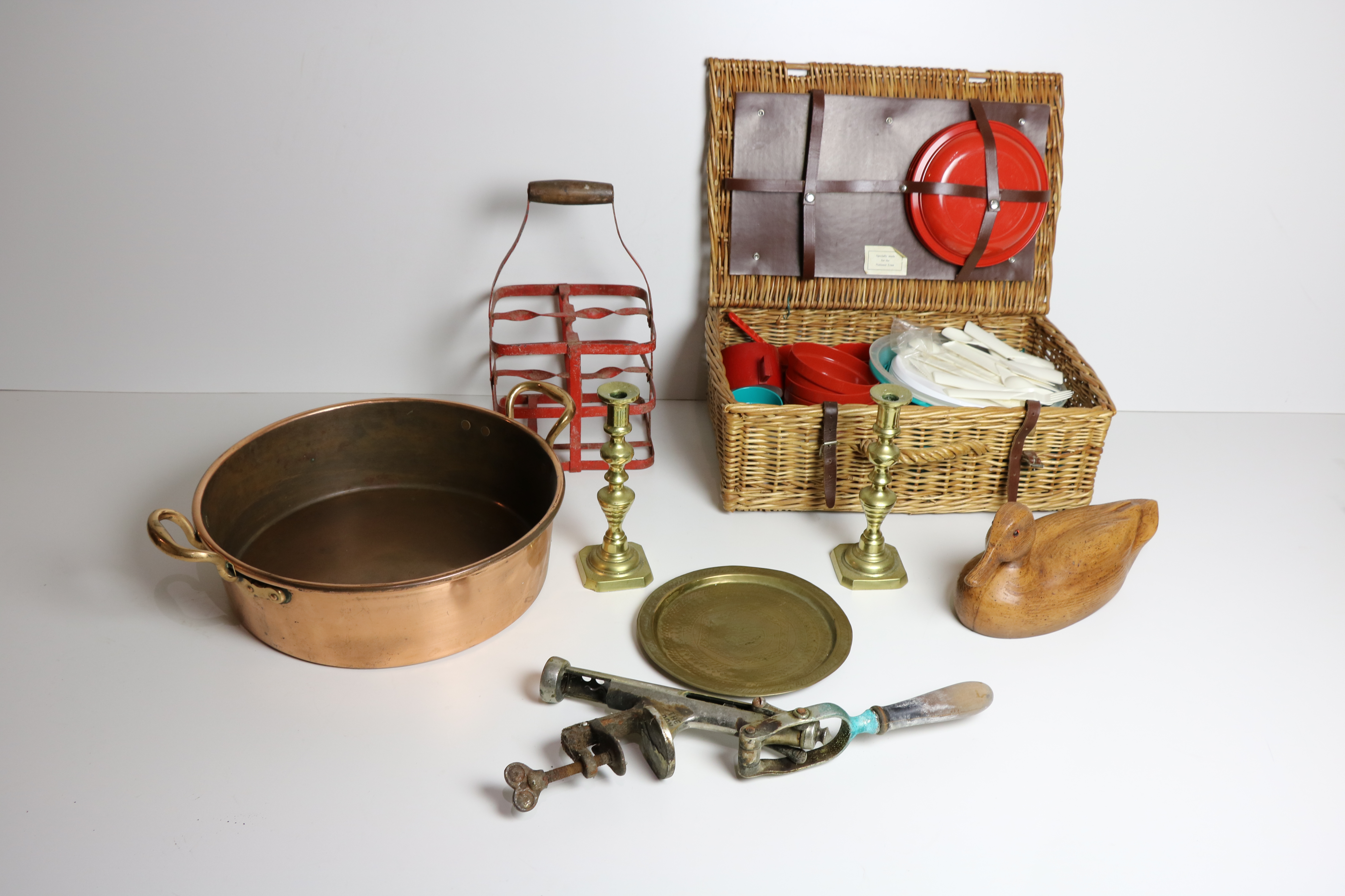 A large two handled Copper Preserving Pan, a Picnic Basket, a pair of brass Candlesticks,