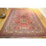 An attractive Turkish heavy woolen Carpet, with large pink ground central panel,