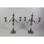 A pair of large silver plated two branch, three light Candelabra, with embossed decoration,