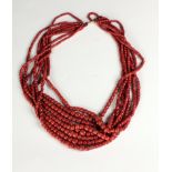 An attractive 8 strand graduating coral Necklace, with gold clasp, 66cms (26") opened.