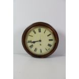 A circular Victorian mahogany Wall Clock, with brass rim, the painted dial with Roman numerals.
