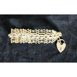 An attractive Edwardian 9ct gold shaped link Bracelet, set with sapphire and diamond type stones,