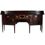 A George III inlaid bow fronted mahogany Sideboard, with centre frieze drawer,