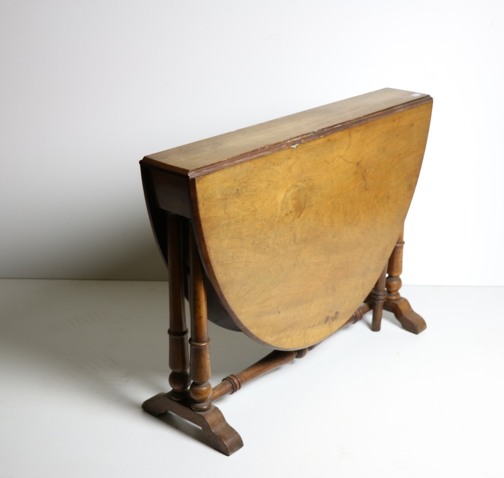 A 19th Century walnut Sutherland Table or Yacht Table, with turned supports.