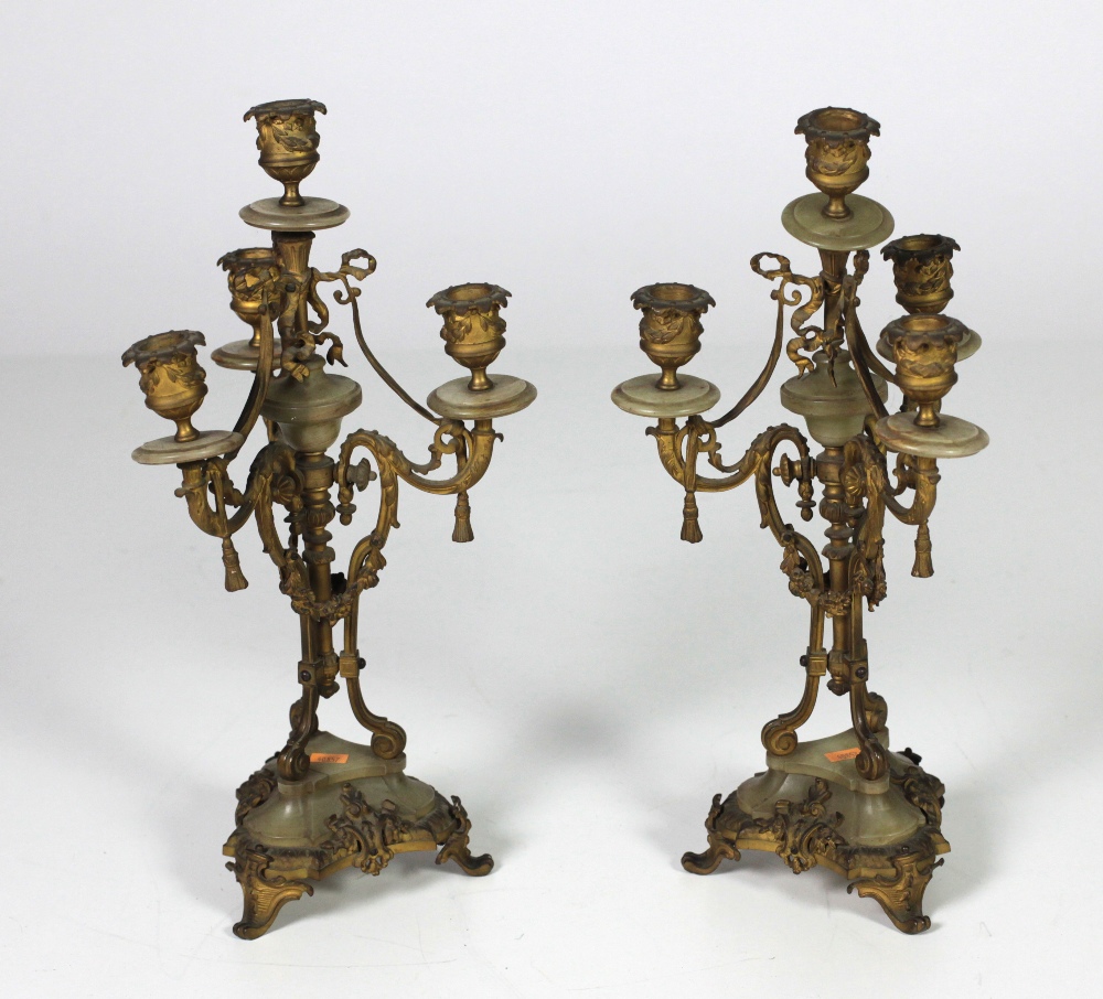 An attractive pair of 19th Century French ormolu and onyx marble three branch,