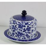 A blue and white porcelain Cheese Coaster and cover, with floral design.