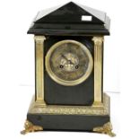 A 19th Century black marble ormolu mounted pillar Mantle Clock,