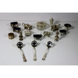 A collection of silver Condiments, mustard pots with blue glass liners, salt cellars,