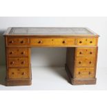 A Victorian Irish oak kneehole Pedestal Desk, the moulded top with leather inset centre,