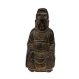 A heavy early Chinese bronze Figure, of a seated Buddha with hands on knees, 22cms (8 1/2").