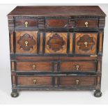 An 18th Century Continental mahogany Chest of drawers, the plain top over a dentil moulded frieze,