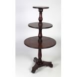 A William IV period Irish mahogany three tier graduating circular Dumbwaiter, on a triform base,