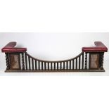 A large late 19th Century oak Club Fender, with upholstered corner seats,