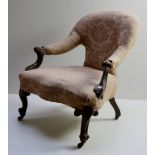 A Victorian walnut Open Armchair, covered in cream ground damask fabric,