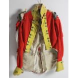 A late 19th Century red velvet and yellow tail Coat,