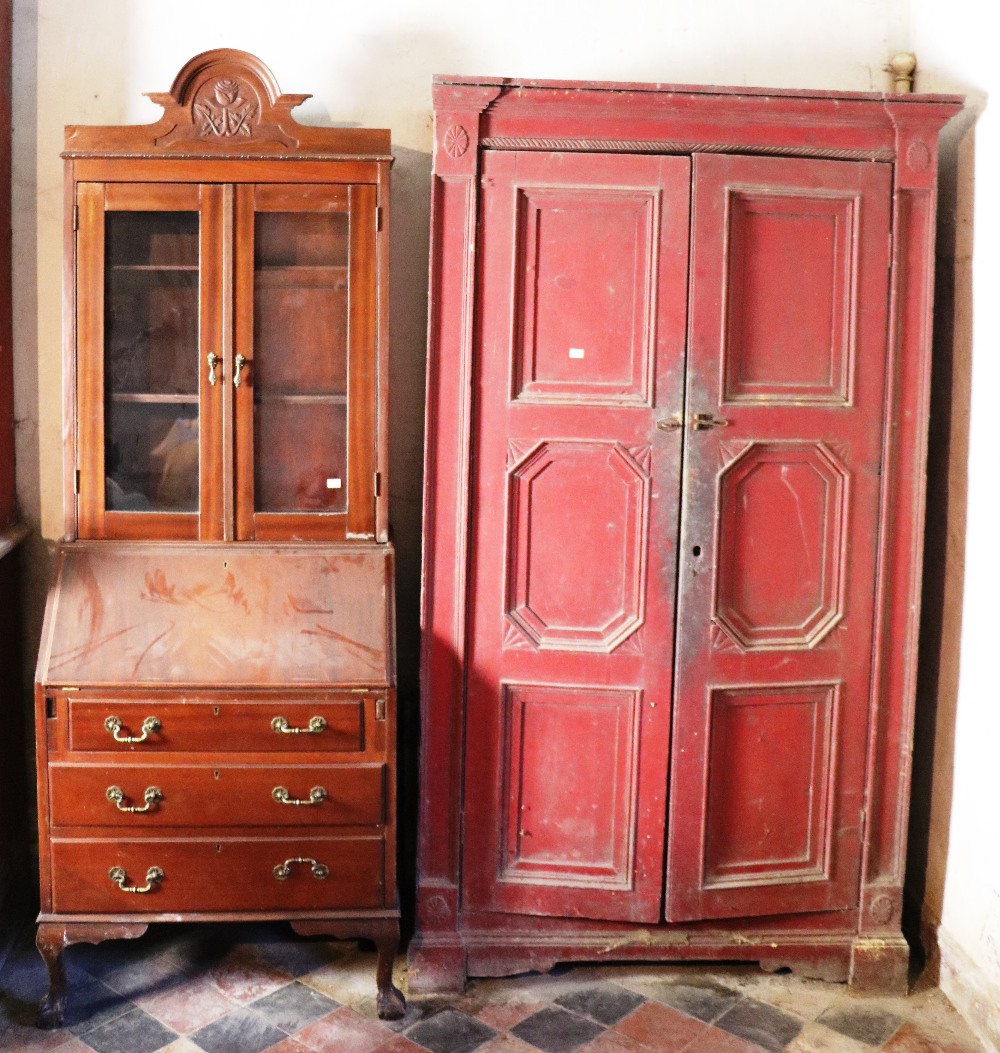 An antique painted pine two door Cupboard, with carved panels,