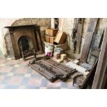 A collection of antique metal Fireplaces, and fenders, part marble fireplaces, tiles etc.