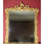 A fine Victorian rococo revival carved giltwood Overmantel Mirror,