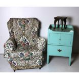 A floral covered wing back Divan Armchair, an old painted pine pull-out Commode Bedside Locker.