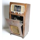 An old upright Pye Radiogram, walnut case, and a later chest shaped G.E.C. ditto. As a lot, w.a.f.