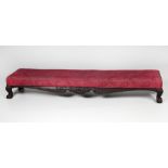 A Victorian mahogany front long rectangular Footstool, covered in pink fabric, approx.