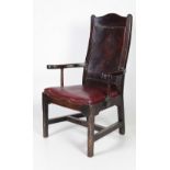 An unusual 18th Century Georgian period mahogany Armchair, with a shaped figured panel back,