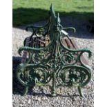 A rare and unusual 19th Century heavy cast iron double sided Garden Bench, with flower head,