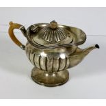 A small attractive Victorian silver Teapot, London c. 1885, maker E.H. (Messrs.