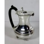 A plain Sheffield silver Hot Water Jug, with gadroon rim and wooden handle, c. 1927, approx.