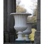 A massive pair of 19th Century English cast iron Garden Urns, with gadroon edge, reeded bodies,
