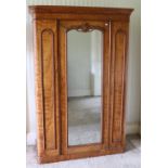 A Victorian maple Wardrobe, with long central mirror, moulded cornice with fitted interior, approx.