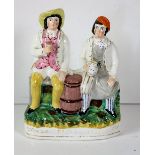 A 19th Century Staffordshire Group, "Tam O Shanter & Sooter Johnny," 34cms (13 1/2") high.