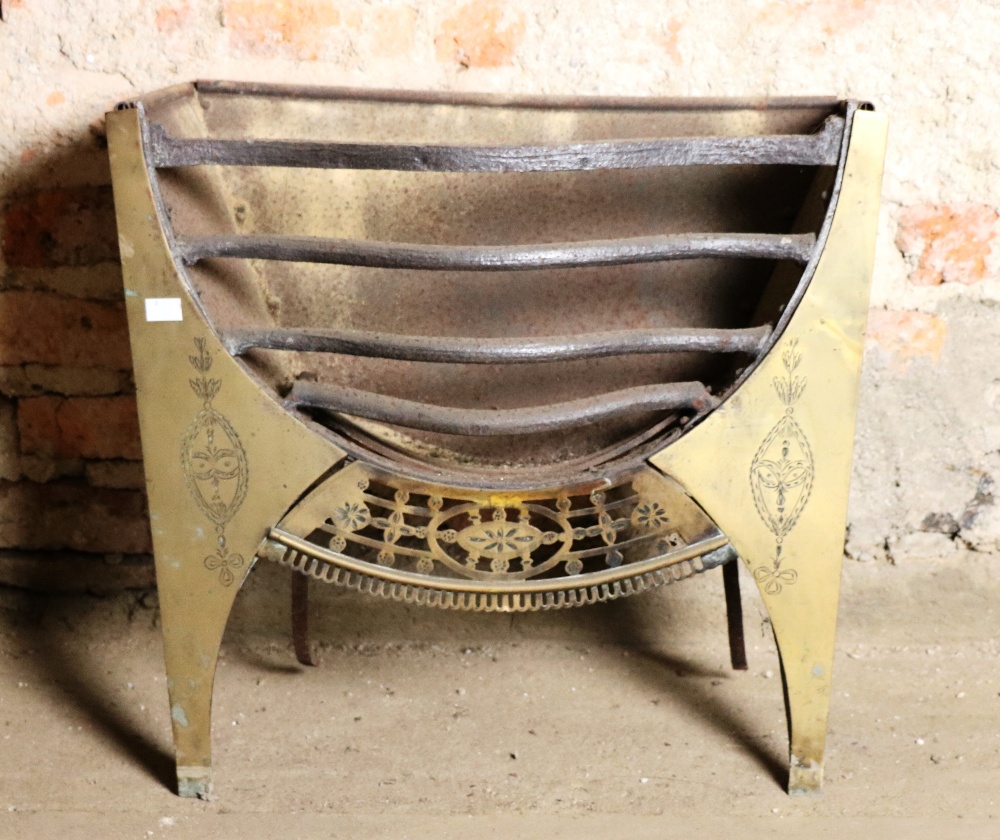 A small antique metal Fire Grate, with engraved brass sides, and pierced brass frieze,