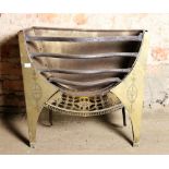 A small antique metal Fire Grate, with engraved brass sides, and pierced brass frieze,