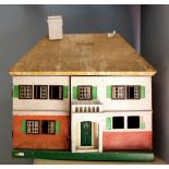 An early 20th Century Dolls House, the interior with various toys etc.