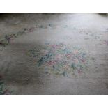 A large French style cream ground woolen Carpet,