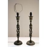 A pair of 19th Century Arabesque type Candlesticks, converted to lamps, highlighted in gilt,